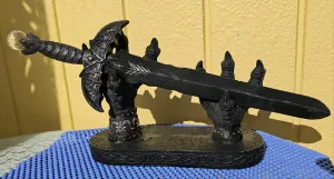DRAGON HANDS HOLDING SWORD